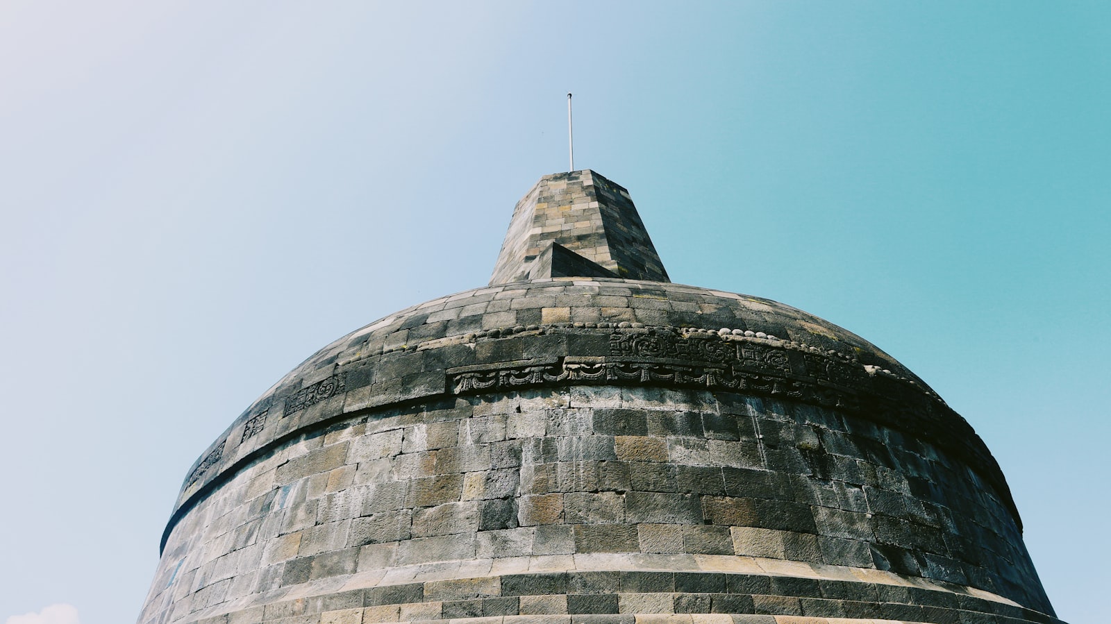 Ancient stupa at Anuradhapura Sri Lanka, white dome against blue sky, UNESCO world heritage ancient city